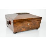 A 19th century rosewood jewellery box, raised on squat bun feet, 14 by 29 by 23cm.