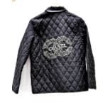 A Chanel style padded jacket, with diamante logo.