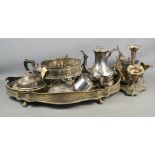 A group of silver plateware including large oval tray, teapots, vases and other items.