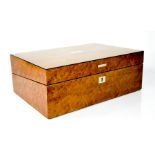 A 19th century birdseye maple workbox with green leather interior, 14 by 38 by 26cm.