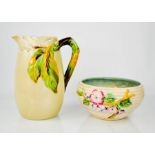 A Clarice Cliff pottery bowl, together with a Clarice Cliff Autumn Leaves pattern jug 33cm high.