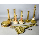 A box of brassware including for candle sticks, one in the form of columns, two with wax ejection