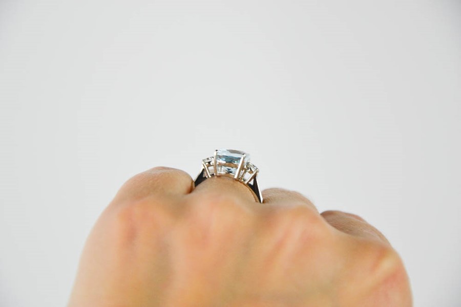 A platinum, aquamarine and diamond ring, the rectangular cushion cut aquamarine approximately 3. - Image 3 of 5