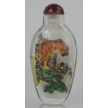 A Chinese reverse painted, signed glass snuff bottle of tigers