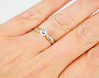 A platinum and diamond solitaire ring, the brilliant cut diamond approximately 0.41ct, assessed as H - Image 3 of 3