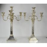 An impressive and fine pair of silver candelabras, by Richard Martin and Ebernezer Hall, the eight
