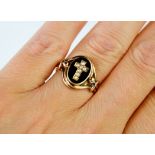 A 9ct gold (tested as) rose gold, pearl and enamel mourning ring with inscription to the inside,