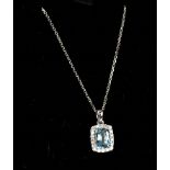 An 18ct white gold aquamarine pendant approximately 1ct surrounded by diamonds approximately 0.