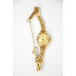 A 9ct gold Everite ladies wristwatch and strap.