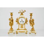 A 19th century French gilt marble clock garniture with gilt metal mounts, the clock having an arabic