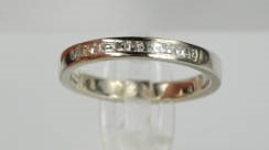 A platinum and diamond eternity ring, the diamonds totalling 0.22ctsm size N, 5.3g. - Image 4 of 5
