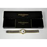 An Yves Saint Laurent wristwatch with original box.