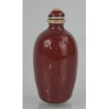 Chinese hand painted and glazed oxblood porcelain snuff bottle with artist mark
