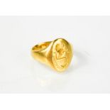 An 18ct gold signet ring engraved with a lion engraved crest, size k, 9g.