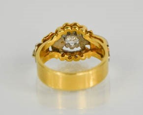 An 18ct gold buckle ring, centred by a diamond approximately 0.35cts and set with twelve further - Image 3 of 5