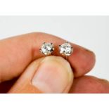 A pair of platinum diamond stud earrings, approximately 0.3cts each
