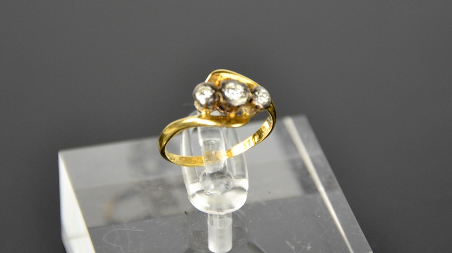 An 18ct gold and three stone diamond ring, size K. - Image 2 of 4