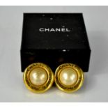 A pair of Chanel pearl earrings, with Chanel box.