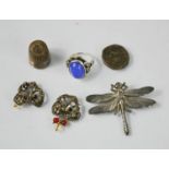 A dragonfly form brooch, two buttons in the form of birds in trees, a silver thimble, a silver
