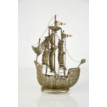 A white metal ship composed of filagree work, 23cm high.