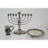 A silver menorah, Birmingham, together with a small silver tankard, 8.42toz, and a white metal