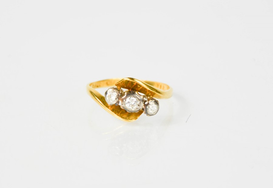 An 18ct gold and three stone diamond ring, size K. - Image 4 of 4