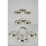 A set of ten Frank M. Whiting & Co. sterling silver rimmed glass coasters, with starburst cut bases,