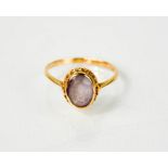 A 9ct gold ring set with amethyst, size N½, 2.1g.