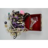 A jewellery box containing silver, necklaces, earrings, rings, bangles and other items.