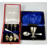 A silver christening set; egg cup and spoon, in original presentation box, a silver knife and a