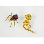 A gilt metal brooch in the form of a monkey, together with an amethyst and gilt metal brooch in