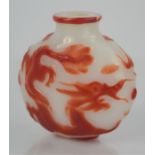 A vintage Chinese peking glass snuff bottle overlaid carved dragon design