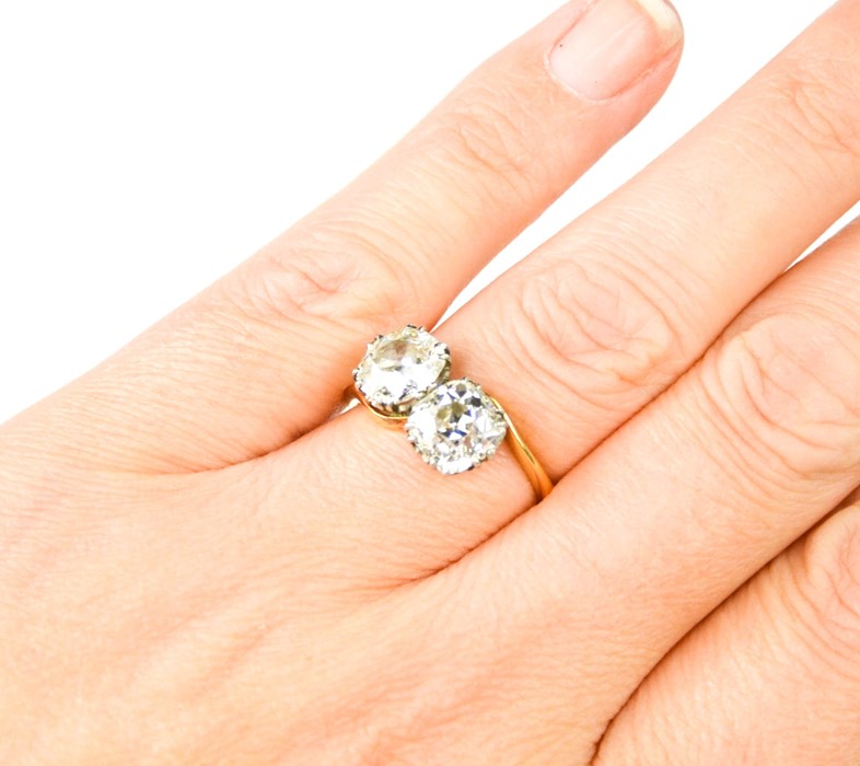 An 18ct gold 'Toi et Moi' diamond crossover ring, set with two large diamonds, each approximately - Image 2 of 8