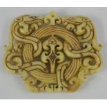 A Chinese natural jade handcarved pendant of two intertwining dragons