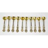 A set of ten silver ladles with gilded bowls, London, 10.19toz.