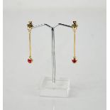 A 9ct yellow gold (tested) diamond 0.3ct and ruby 0.4cts drop earrings.