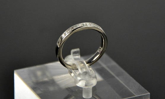 A platinum and diamond eternity ring, the diamonds totalling 0.22ctsm size N, 5.3g. - Image 5 of 5