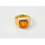 A 9ct gold ring, set with amber cabochon.