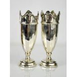 A pair of silver spill vases, Birmingham, initialled and dated 1931, with weighted bases, 13cm