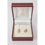 An 18ct yellow gold and diamond earrings - diamond approx 0.33ct