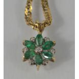 A 9ct gold necklace with emerald and diamond flowerhead pendant 4.8g