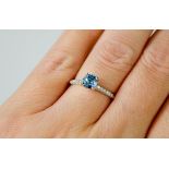 A 14ct white gold aquamarine ring approximately 0.6ct with diamond set shoulders - Size M - weight