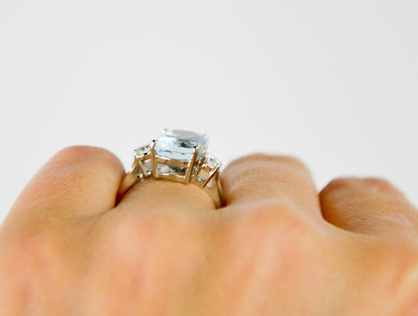 A platinum, aquamarine and diamond ring, the rectangular cushion cut aquamarine approximately 3. - Image 2 of 5