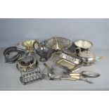 A quantity of silver plate items to include, teapot , toast rack, ladle, spoons etc