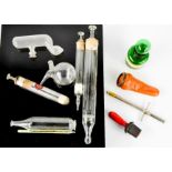 A group of chemists accessories, to include glass vials, tube feeder, duck billed nasal douche,