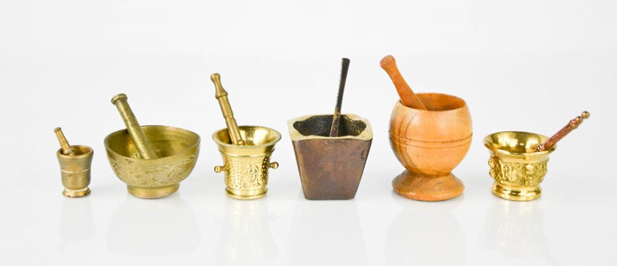 Six miniature pestle & mortars, of various form, the smallest measures 2½cm high.