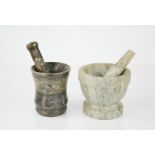 A marble pestle & mortar, together with a stone carved example from the Dead Sea 9½cm high.