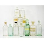 A group of vintage glass medical bottles: Owbridges Lung Tonic, John Allen & Co of Leicester, a