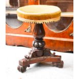 A Victorian rosewood piano stool, with velvet revolving top, and carved bases, 48cm high.