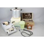A pressure cooker, a stethoscope, a Respiratory Treatment Unit, Olivetti calculator and other items.